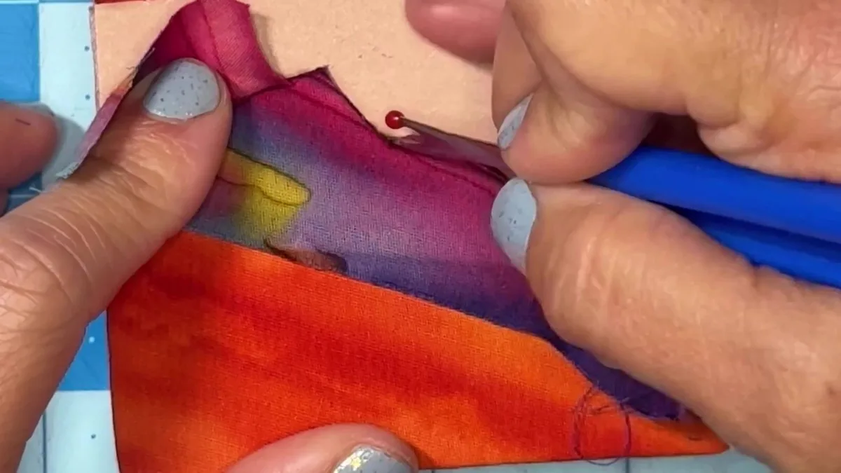 Practicing kinusaiga cutting and tucking technique on a scrap foam board